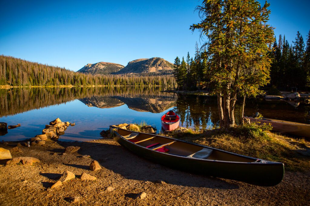 Two Canoes On A Tranquil Lakeshore